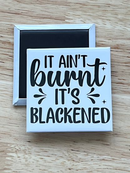 It Ain’t Burnt It’s Blackened 2.5" Square Magnet